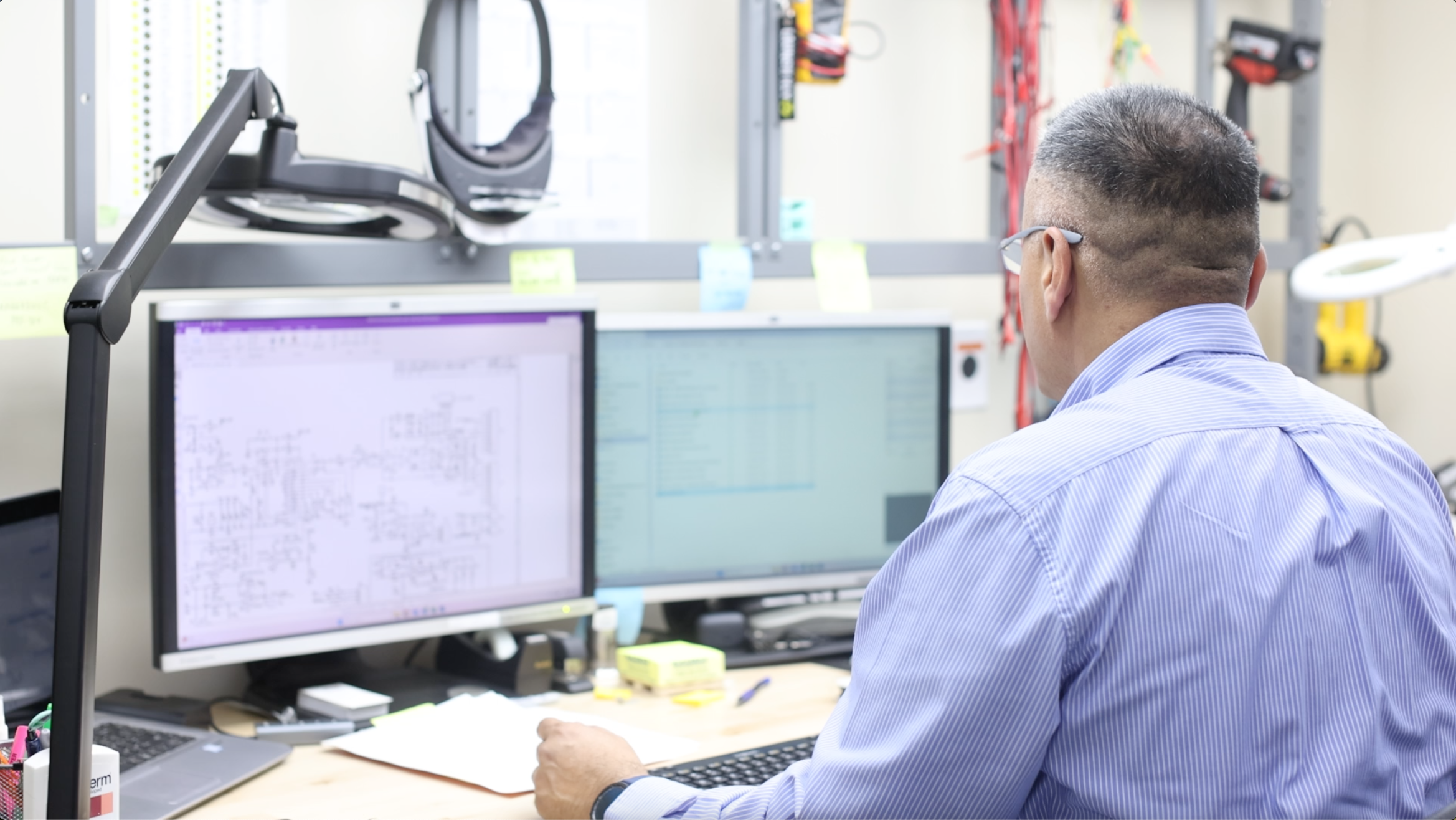 ATS employee working at a work desk in the rental and repair center